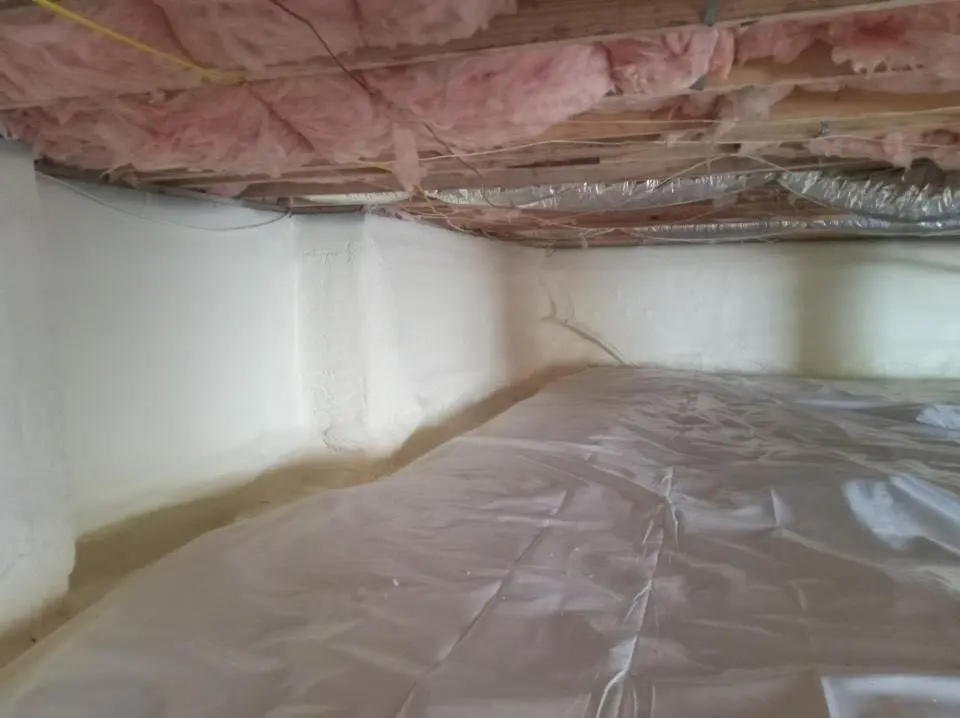 Crawl space encapsulation with closed-cell spray foam for Commercial Roof Restoration in Central
